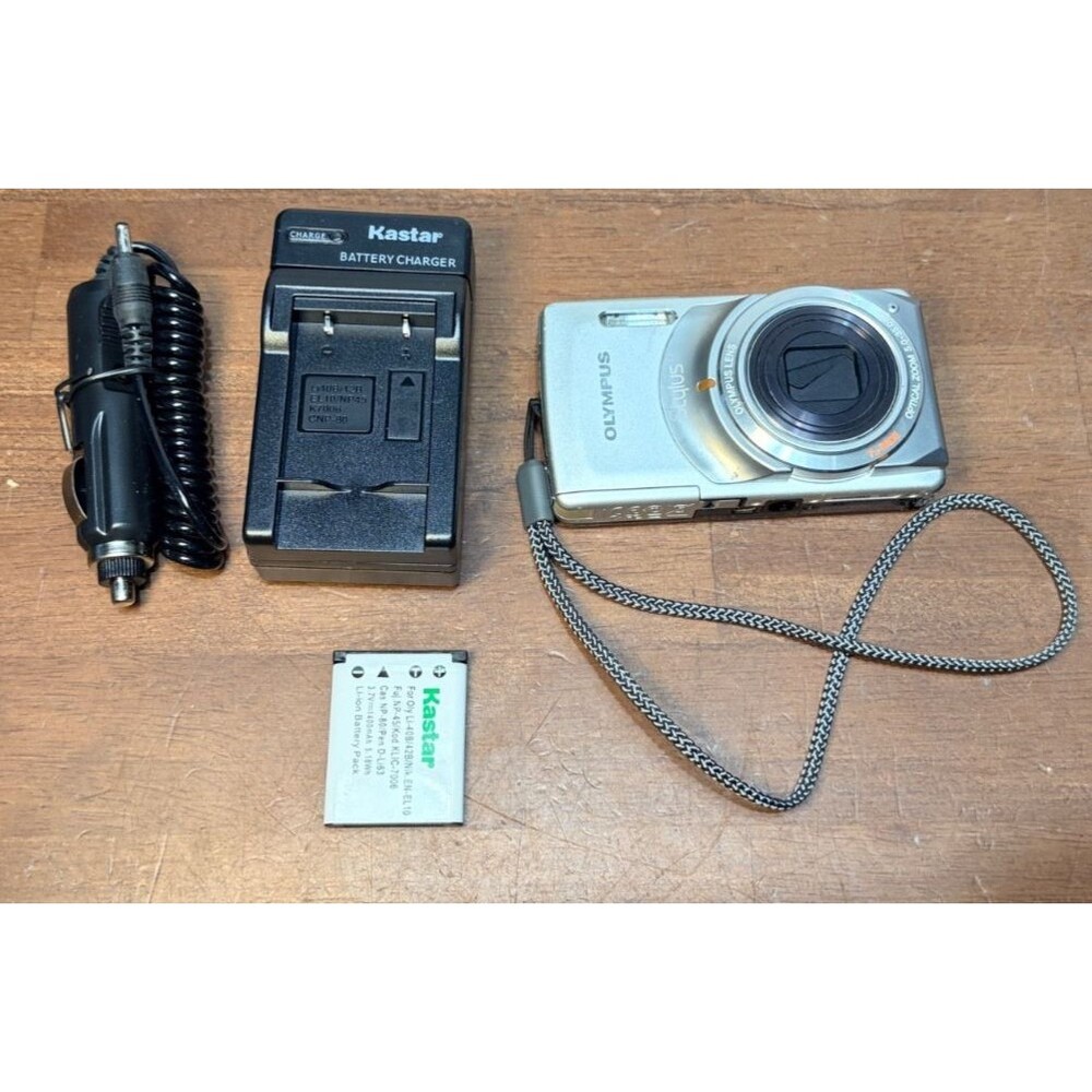 Olympus Stylus 7010 12.0MP Digital Camera Silver Point Shoot w/Batt & charger